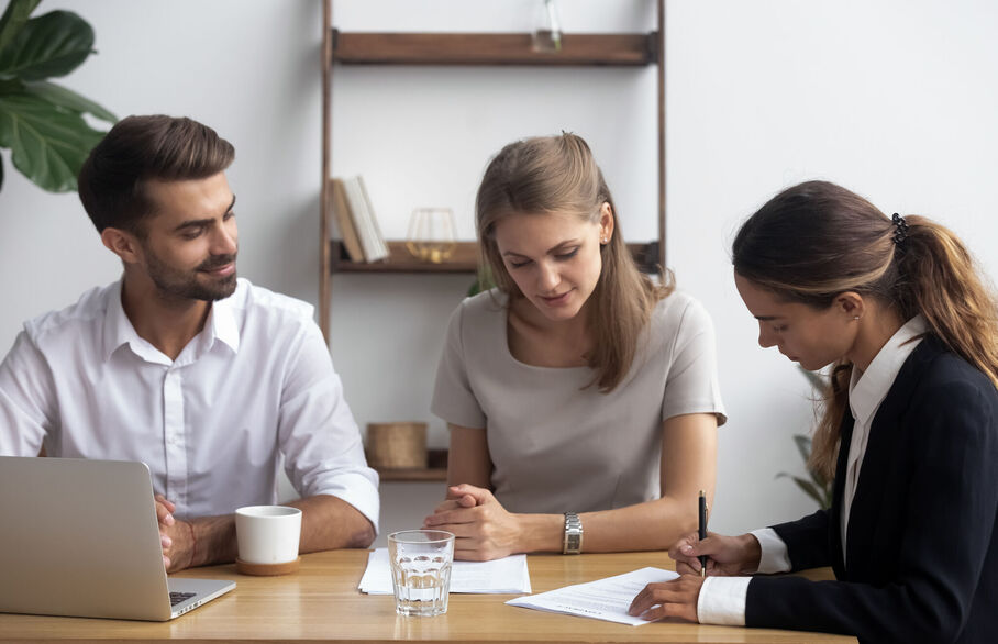 Three people having a meeting