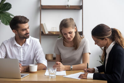 Three people having a meeting