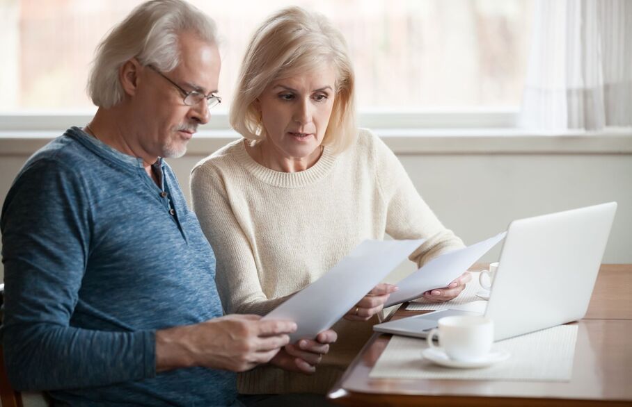 Two people looking at a piece of paper