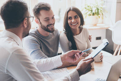 Three people having a meeting