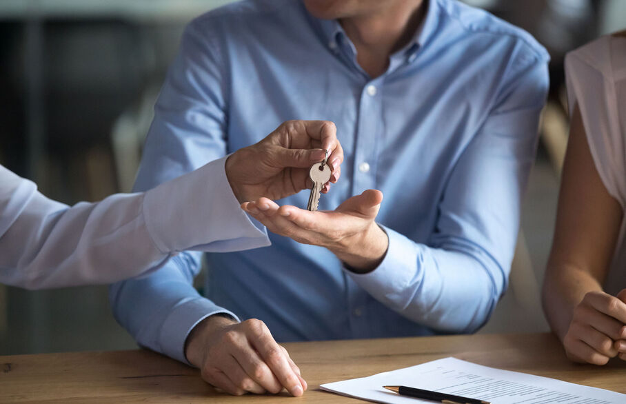 Someone being handed over a set of keys