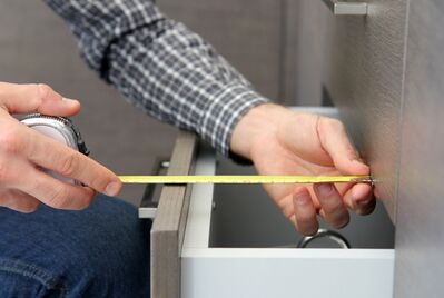 Someone measuring a draw