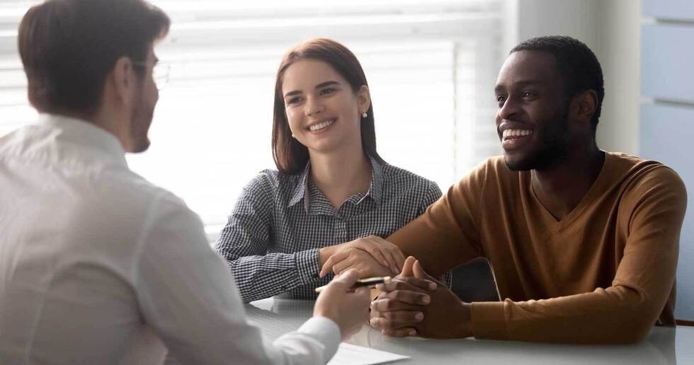 Couple at meeting with estate agent