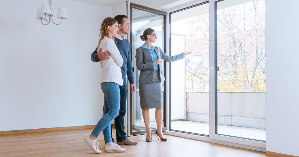 Young couple getting tour through apartment