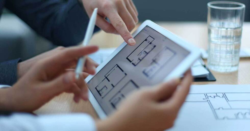 looking at a floorplan on tablet