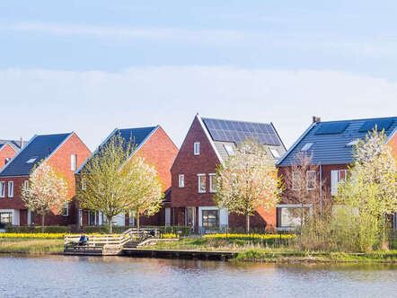 A row of houses next to water