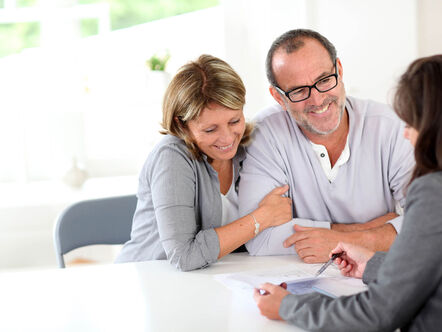 A couple talking to an estate agent