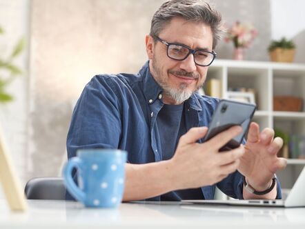 A man looking at a phone