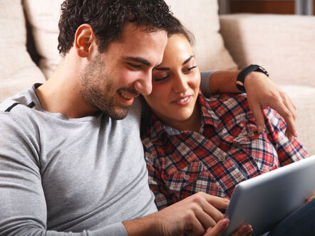 Young couple looking at tablet