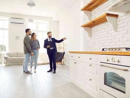 Couple being shown kitchen